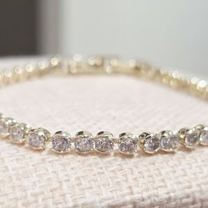 Elegant Gold and Tennis Bracelet